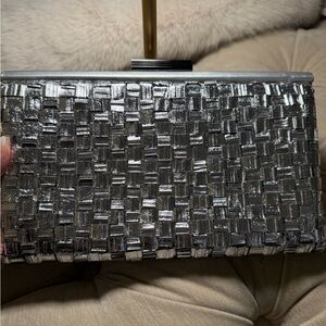 Silver woven leather Clutch evening bag Gorgeous sleek look.10 x 6 dust bag.